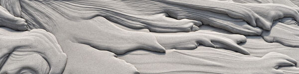 Sludge bed mud formations  - grey layers of drying sludge