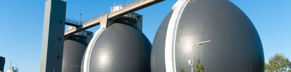 An image of three egg-shaped reactors used for the anaerobic digestion of sewage sludge